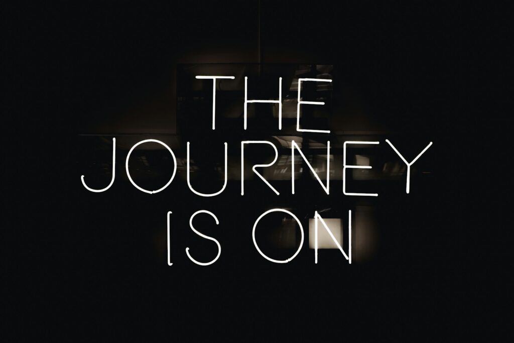 a black and white photo with the words the journey is on